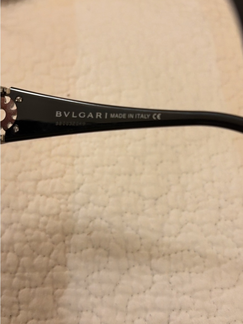 Bulgari Black Women's Sunglasses with gold sun burst temple accents